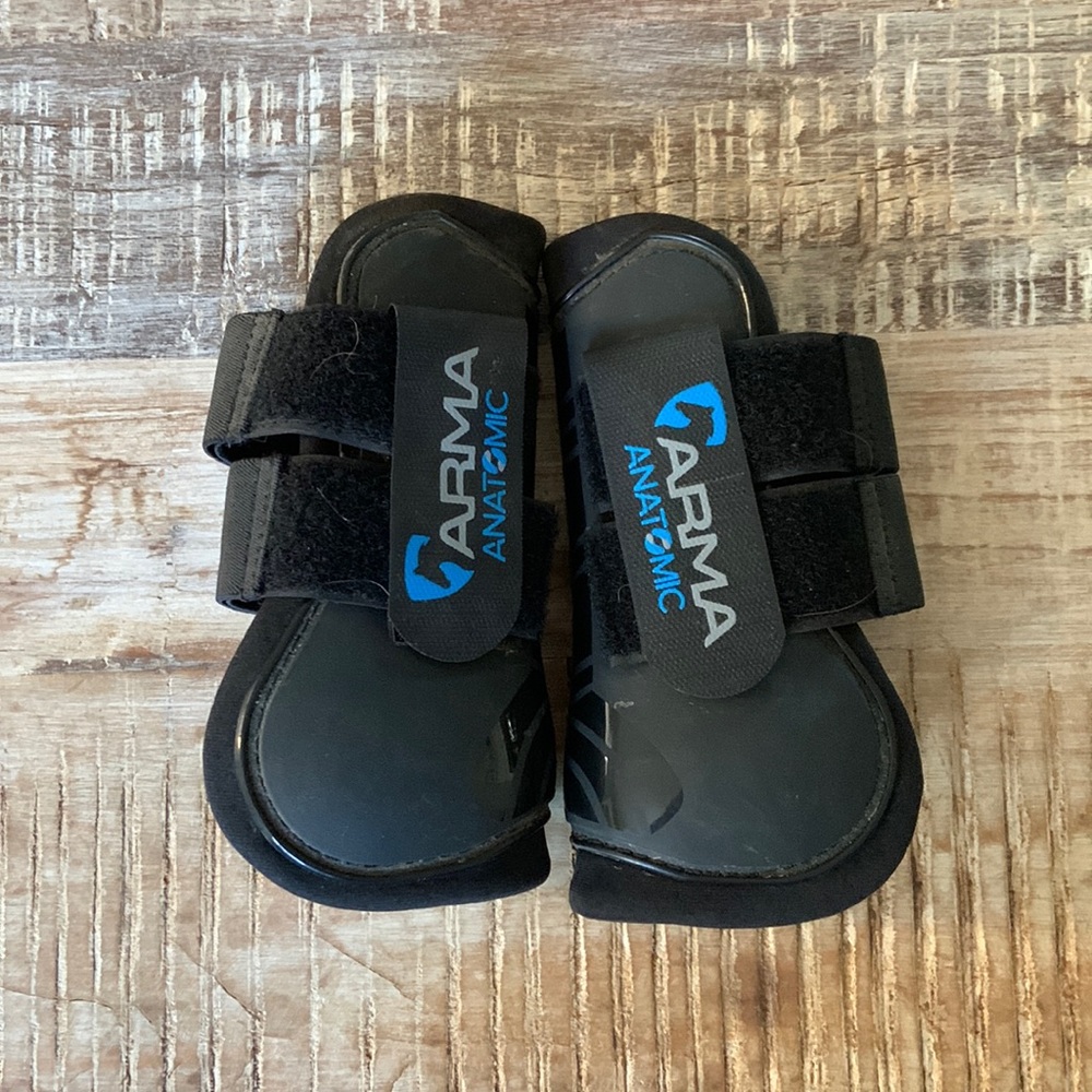 Arma pony sized black fetlock and open front boots.
